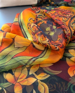 Detail of bohemian floral print scarf showing lightweight semi-transparent fabric texture