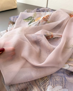 Detailed close-up of semi-transparent floral print chiffon scarf with delicate texture