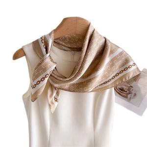 Classic plaid print silk scarf featuring chain patterns on an elegant cream background