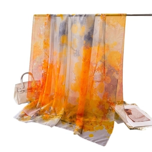 Long chiffon scarf featuring artistic orange and grey ink print for women's sun protection