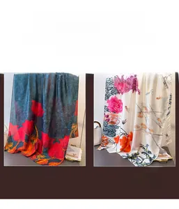 Detail of elegant floral patterns on satin scarves featuring tulip and peony designs