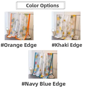 Detailed view of floral silk scarves in orange, khaki, and navy blue color options