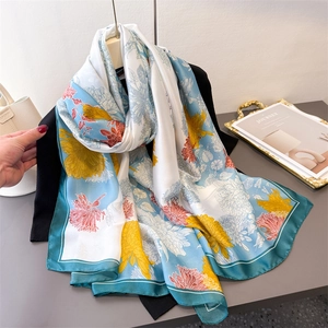 Light blue floral silk scarf with yellow chrysanthemum patterns and dark green borders