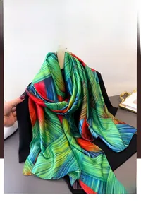 Detailed view of colorful silk scarf with dynamic green blue and red abstract lines
