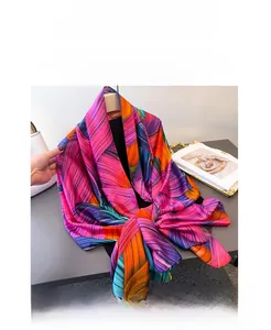 Close-up of vibrant color-block geometric print silk scarf with luxury glossy texture