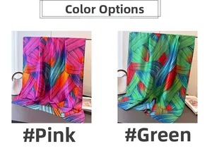 Detail view of abstract colorful stripe prints on pink and green silk satin scarves