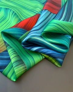 Close-up of vibrant wavy pattern and smooth silk texture on luxury satin shawl