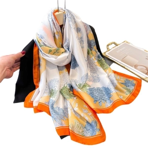 Elegant silk-like floral scarf with orange border and blue chrysanthemum patterns