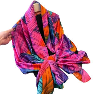 Colorful geometric line print satin silk scarf wrap shawl in vibrant pink and orange