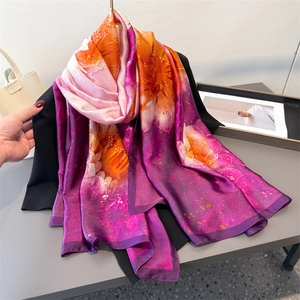 Floral satin long scarf with purple and pink gradient print, worn as a versatile shawl