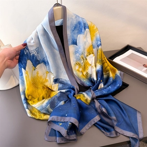 Elegant floral silk scarf in blue and yellow watercolor print for women's sun protection