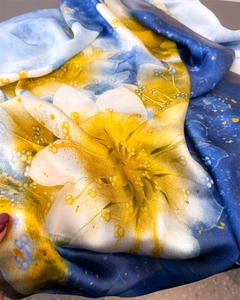 Close-up of lightweight floral silk scarf showing detailed texture and vibrant printing