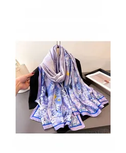 Detail of elegant purple floral silk scarf showing soft texture and artistic flower pattern