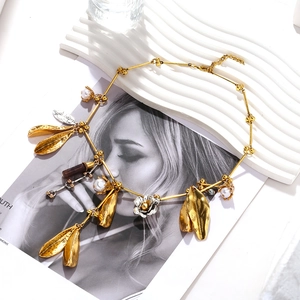 Elegant gold alloy leaf and faux pearl pendant necklace with textured floral accents