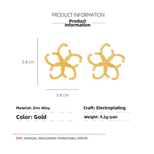 Detail view of gold matte floral earrings with interlinked C-pattern design and 3.8cm size
