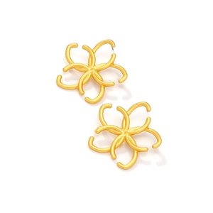 Exaggerated matte gold hollow flower earrings with artistic hollowed petal design
