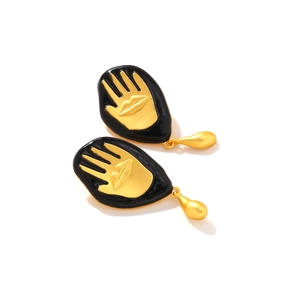 Artistic golden palm and lip drop earrings with black enamel dripping water design