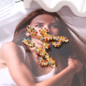 Exaggerated cactus drop earrings with colorful rhinestones in a gold alloy setting