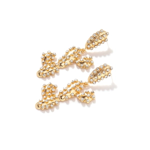 Close-up of gold-plated cactus drop earrings featuring shimmering crystal pavé details