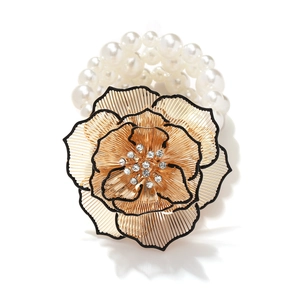 Bohemian multilayer pearl bracelet with a large golden 3D flower and crystal detailing