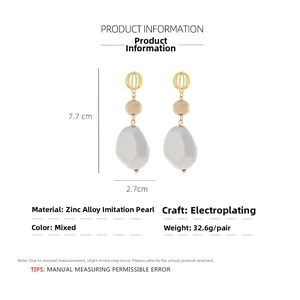 Detailed view of long baroque pearl earrings with dimensions showing 7.7cm height