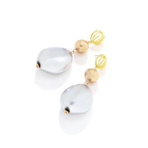 Macro detail of long Baroque earrings featuring irregular grey pearls and golden cage elements