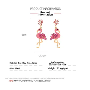 Detail view of pink flamingo earrings with dimensions of 6cm by 2.3cm and zinc alloy material