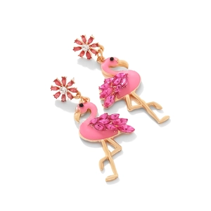 Detailed close-up of pink flamingo earrings with enamel wings and gemstone accents