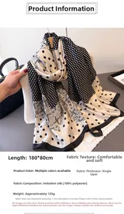 Detail of black and white polka dot scarf with 180x80cm size and soft polyester texture