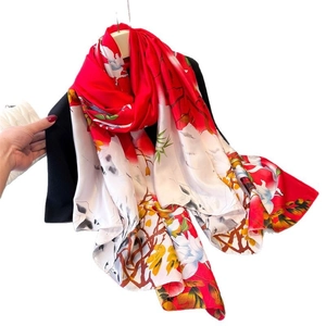 Floral print satin silk scarf with red and white magnolia pattern and elegant drape