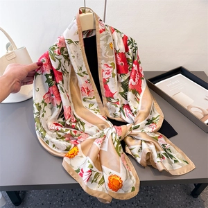 Lightweight floral satin scarf with vibrant red flowers and champagne gold borders