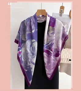 Detail of purple floral silk scarf showing elegant drape and smooth satin texture