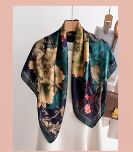 Close-up of floral silk scarf with large peonies and refined machine-stitched edges