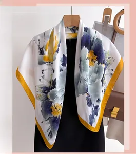 Detailed macro view of the silky fabric texture and blue watercolor floral patterns