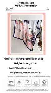 Detail view of floral leaf print silk-like scarf with 90cm size and washing instructions