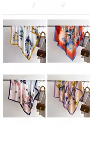 Detail display of four colorful silk-like square scarves with elegant floral patterns