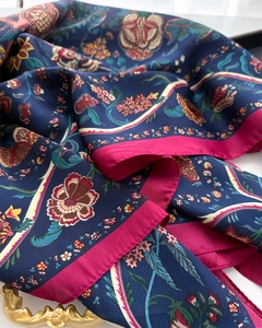 Detailed macro shot of vintage floral silk scarf texture with silk-like sheen and drape
