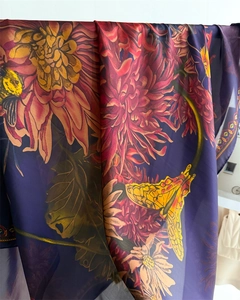 Detail of vintage floral silk scarf featuring dark purple base with autumn chrysanthemums