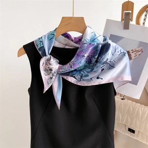 70cm floral silk scarf with elegant blue and purple patterns shown on a black top