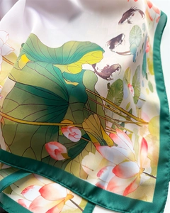 Detail of silk satin scarf showing traditional lotus and goldfish ink painting print