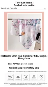 Detail view of 70x70cm silk satin scarf with floral and bird prints and washing instructions