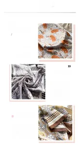 Detail view of paisley silk-feel scarf showing fine stitching and premium fabric texture