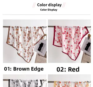 Detail of floral print silk square scarves in brown and red patterns on a metal hanger