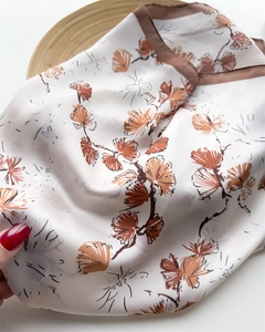 Detailed close-up of 70cm silk-like neck scarf with ginkgo leaf pattern and brown border