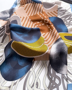 Macro shot of 70cm silk square scarf with geometric plaid and art prints