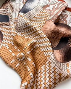 Macro view of silky checkered scarf fabric with fine stitching and satin sheen