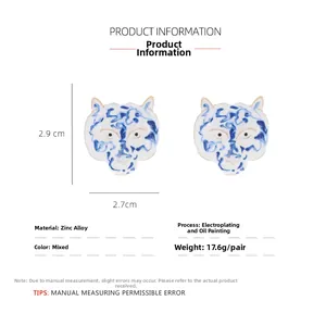 Detail view showing blue and white enamel tiger head stud earrings with size dimensions