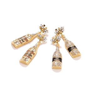 Champagne bottle earrings with rhinestones and Happy New Year text on white background