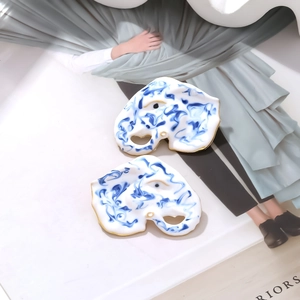 Artistic blue and white marble enamel elephant stud earrings with gold plating edge