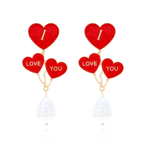 Red heart dangle earrings with I LOVE YOU letters and pearl drops on white background